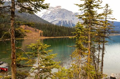 Scenic view of lake and mountains against sky