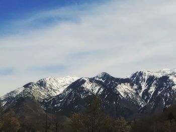 Scenic view of snowcapped mountains against sky