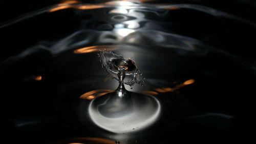 Close-up of water drop against black background