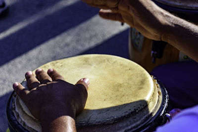 High angle view of person playing guitar on street