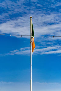 Low angle view of pole against blue sky