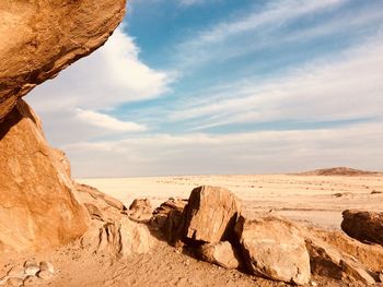 Rock formations in desert against sky