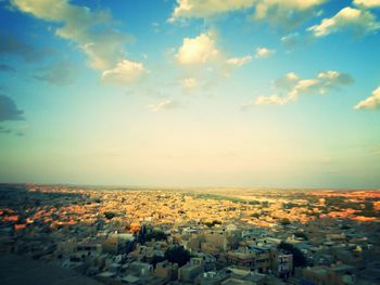 View of cityscape against blue sky