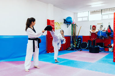 Young women practicing martial arts