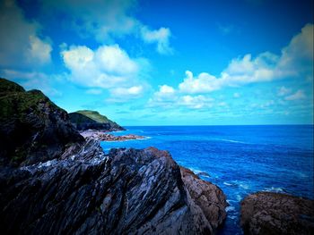 Panoramic view of sea against blue sky