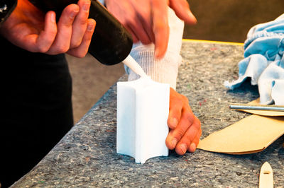 High angle view of people making decoration on table