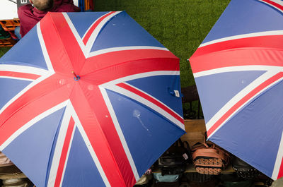 Close-up of flags against blue sky