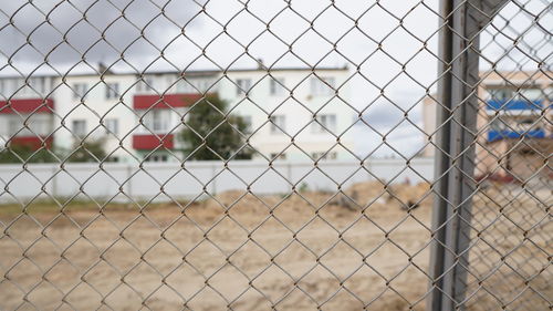 Close-up of love seen through chainlink fence