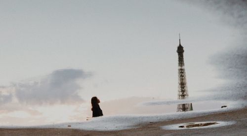 Man on beach against sky