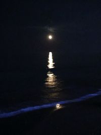 Scenic view of sea against sky at night