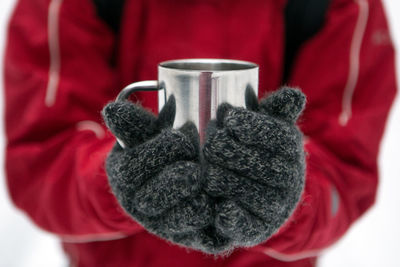 Close-up of hand holding tea cup