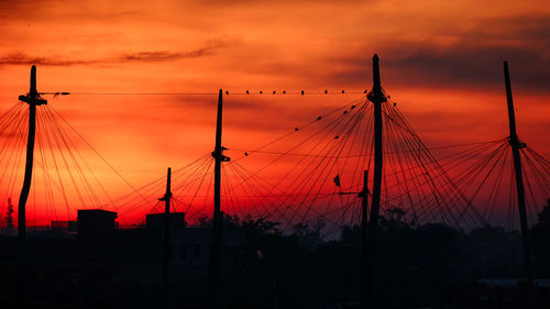 Silhouette of sailboats against sky during sunset