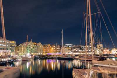 Boats moored at harbor