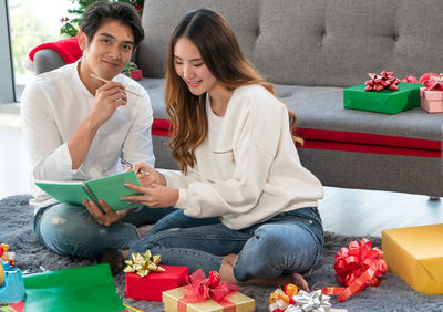 Young couple sitting on sofa