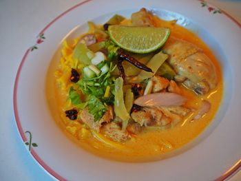 High angle view of thai meal served in bowl, noodle with spicy coconut curry, northern thailand