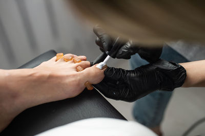 Beautiful salon procedure with pink pedicure on towel background. for decoration design