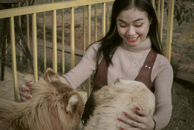 Portrait of young woman with dog