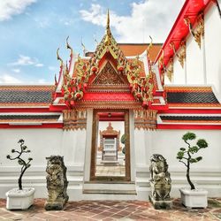 Entrance of temple against building