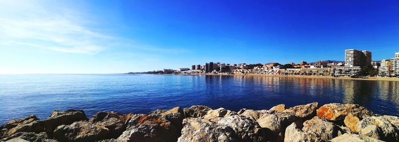 Scenic view of sea against blue sky