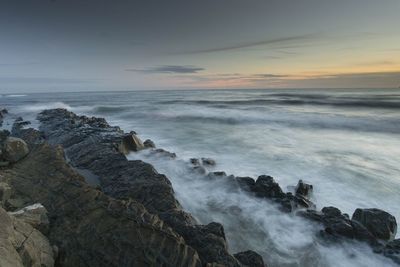 Scenic view of sea against sky at sunset