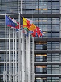 Low angle view of flags against building