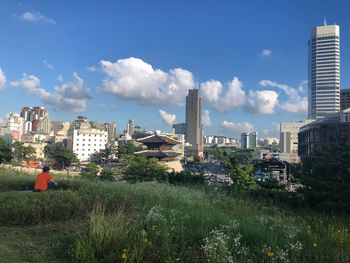 Buildings in city against sky