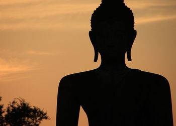 Silhouette of statue against sky