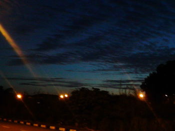 Scenic view of landscape against sky at dusk