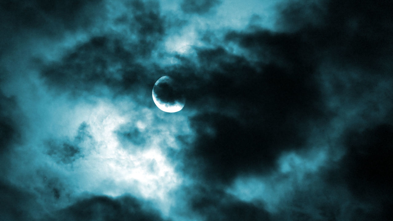 LOW ANGLE VIEW OF MOON AT NIGHT