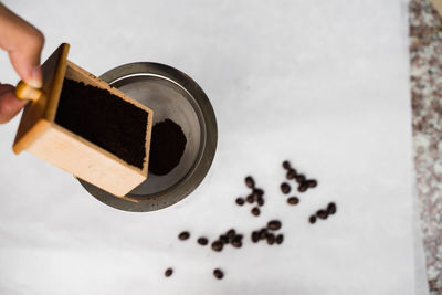 Close-up of hand holding coffee cup