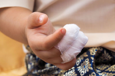 Close-up of hand with bandage on fingers