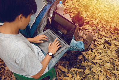 High angle view of boy using laptop