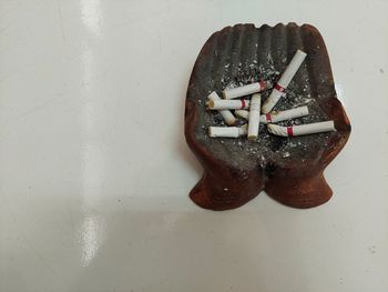 High angle view of cigarette on table