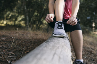 Low section of woman standing on ground
