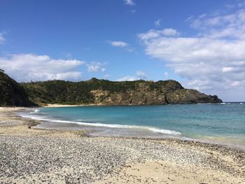 Scenic view of beach against sky