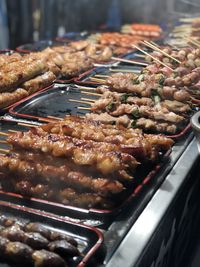 Close-up of meat on barbecue grill