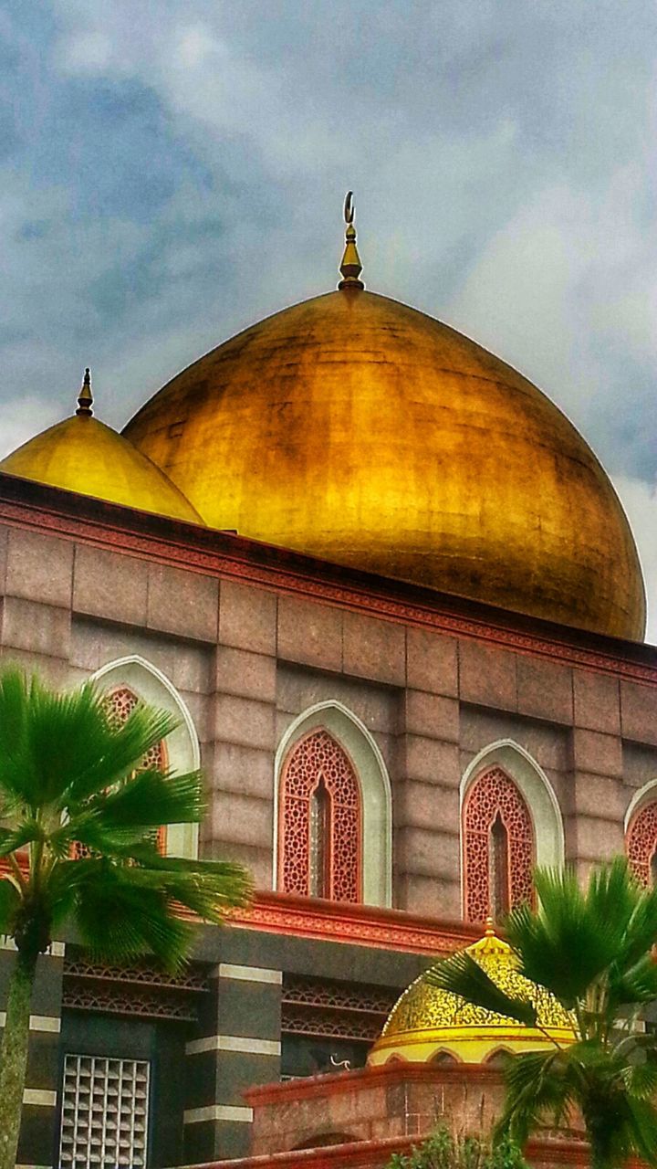 architecture, built structure, building exterior, sky, dome, arch, place of worship, low angle view, religion, spirituality, cloud - sky, facade, no people, travel destinations, tree, outdoors, architectural feature, exterior, church, cloud