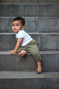 Boy playing in the stairs