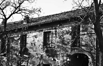 Old building with trees in background