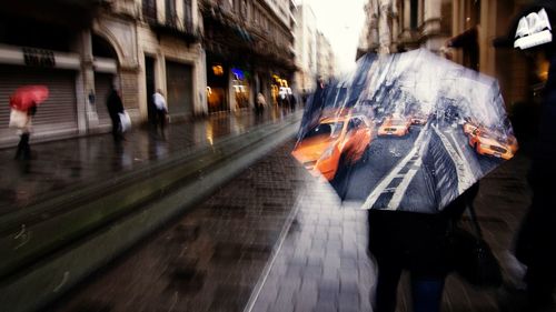 Blurred motion of people walking on train in city