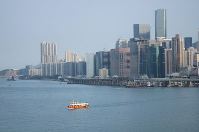 View of bay in city against sky