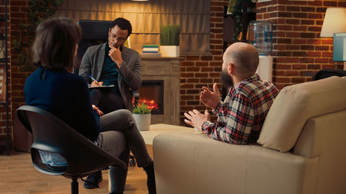 Side view of woman using mobile phone