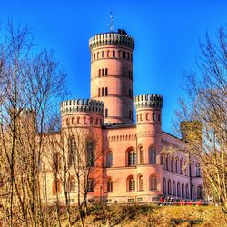 Low angle view of building against clear blue sky