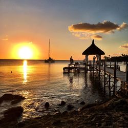 Silhouette of pier at sunset