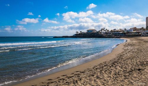 Scenic view of beach against sky