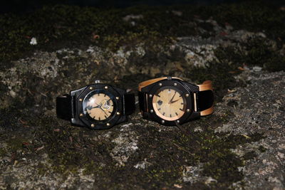 Close-up of wristwatches on rock