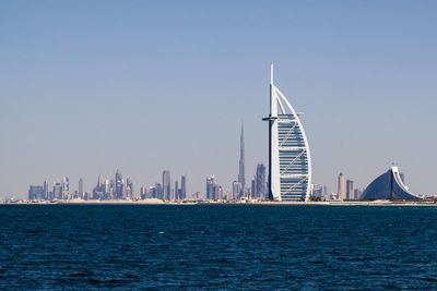 View of buildings in city against clear sky