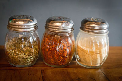 High angle view of glass jar on table