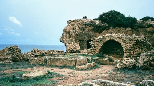 Stone wall with sea in background