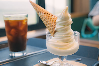 Midsection of woman holding ice cream